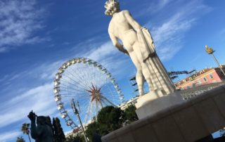 photo de la fontaine du soleil et de la grande roue sur la place massena a nice